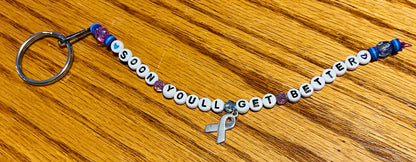 TS ‘Soon You’ll Get Better’ Awareness Keychains